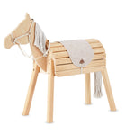 Wooden horse toy with a blanket and reins on a white background