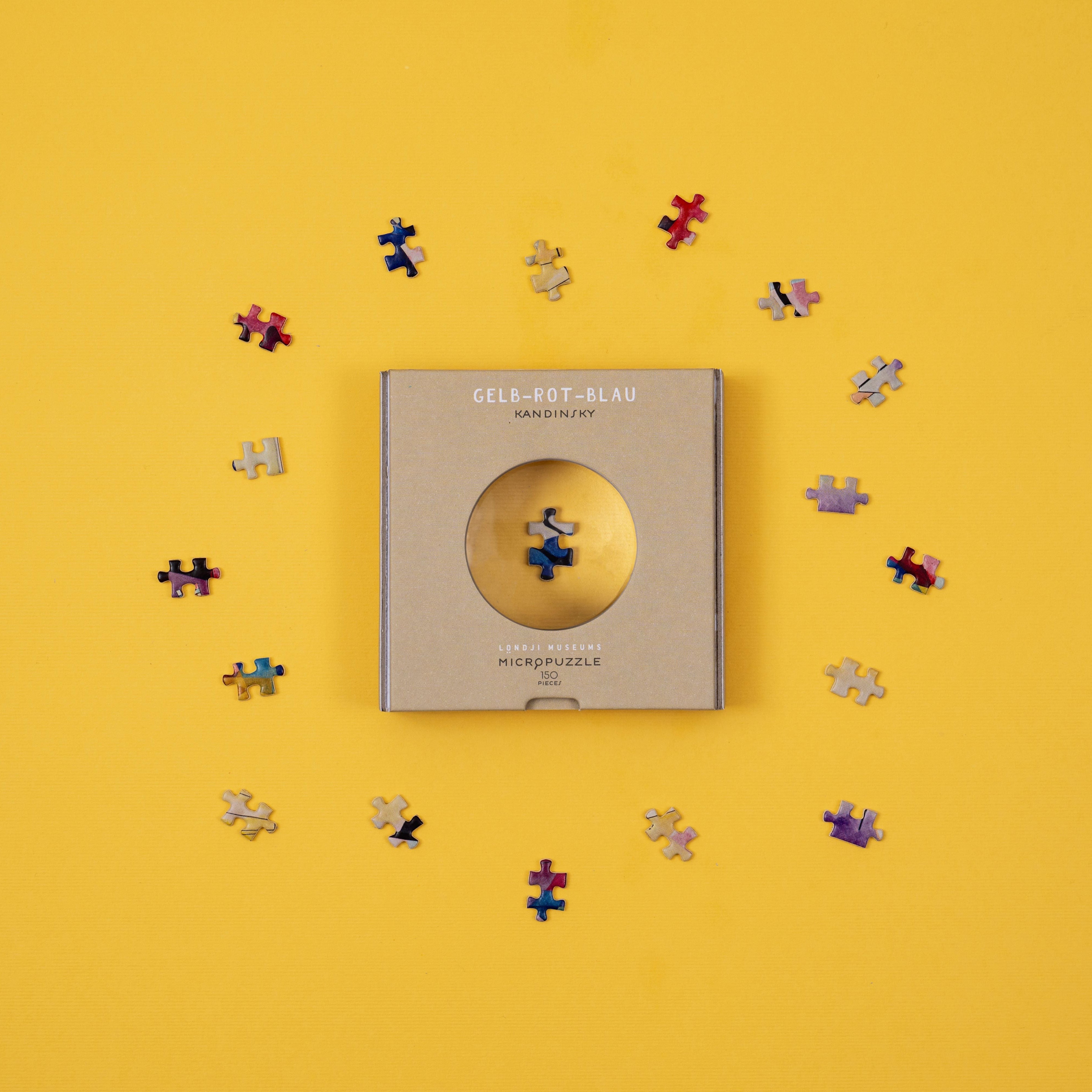 micro puzzles pieces magnified by window on box