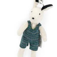 White plush keychain with a black nose, wearing a green outfit on a white background